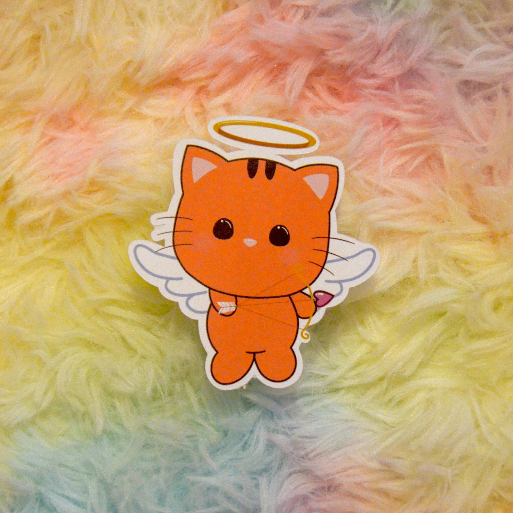 Cupid Taffy with hear bow and arrow sticker against rainbow background