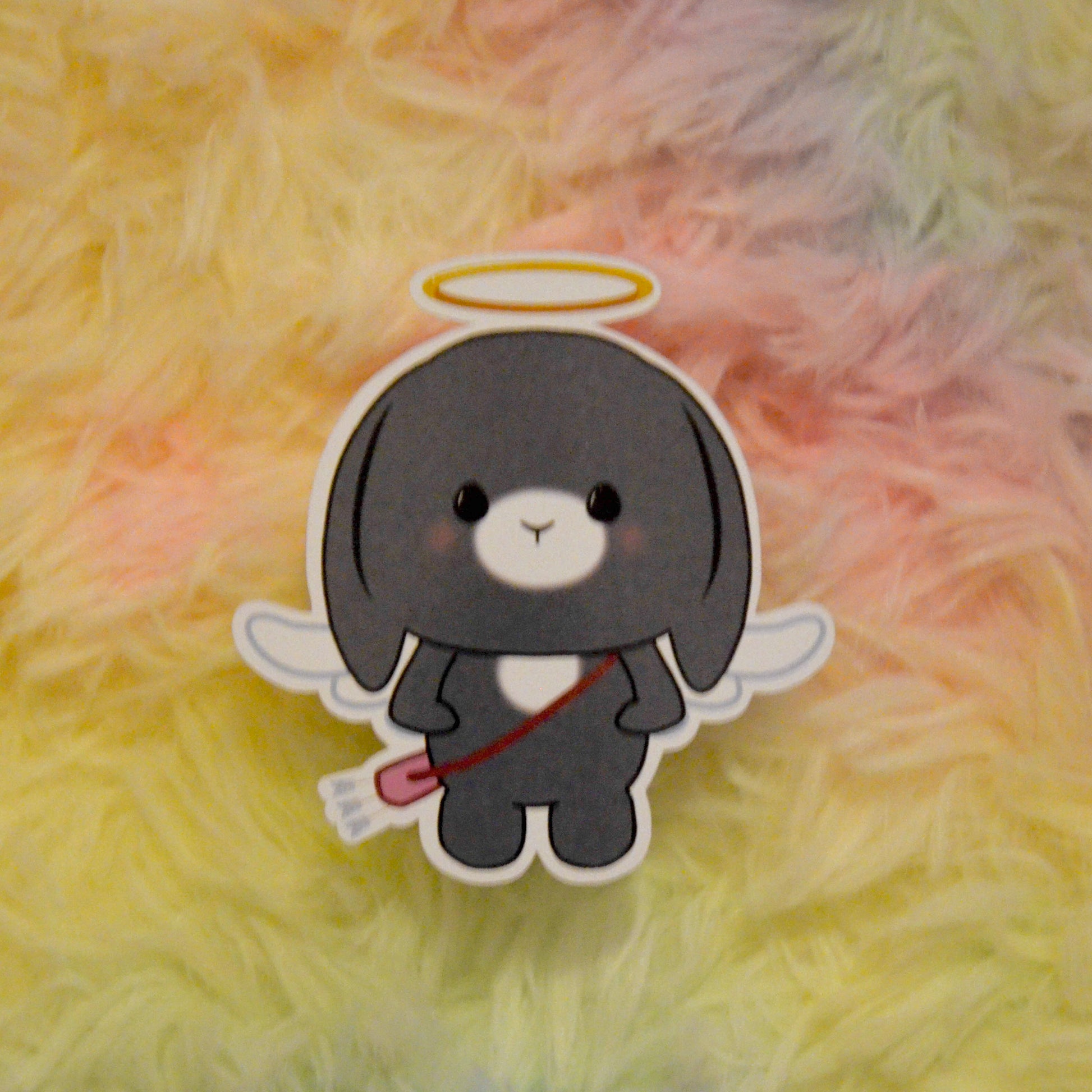 Cupid Bon Bon with arrow bag sticker against rainbow background