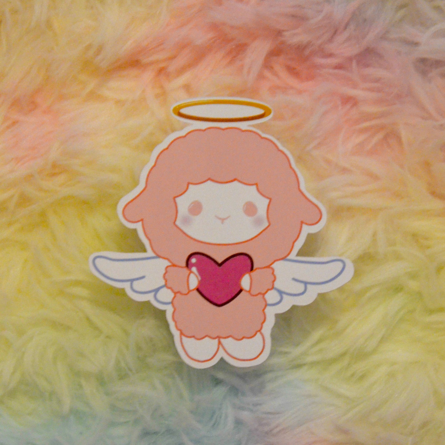 Cupid Fuwa holding heart sticker against rainbow background