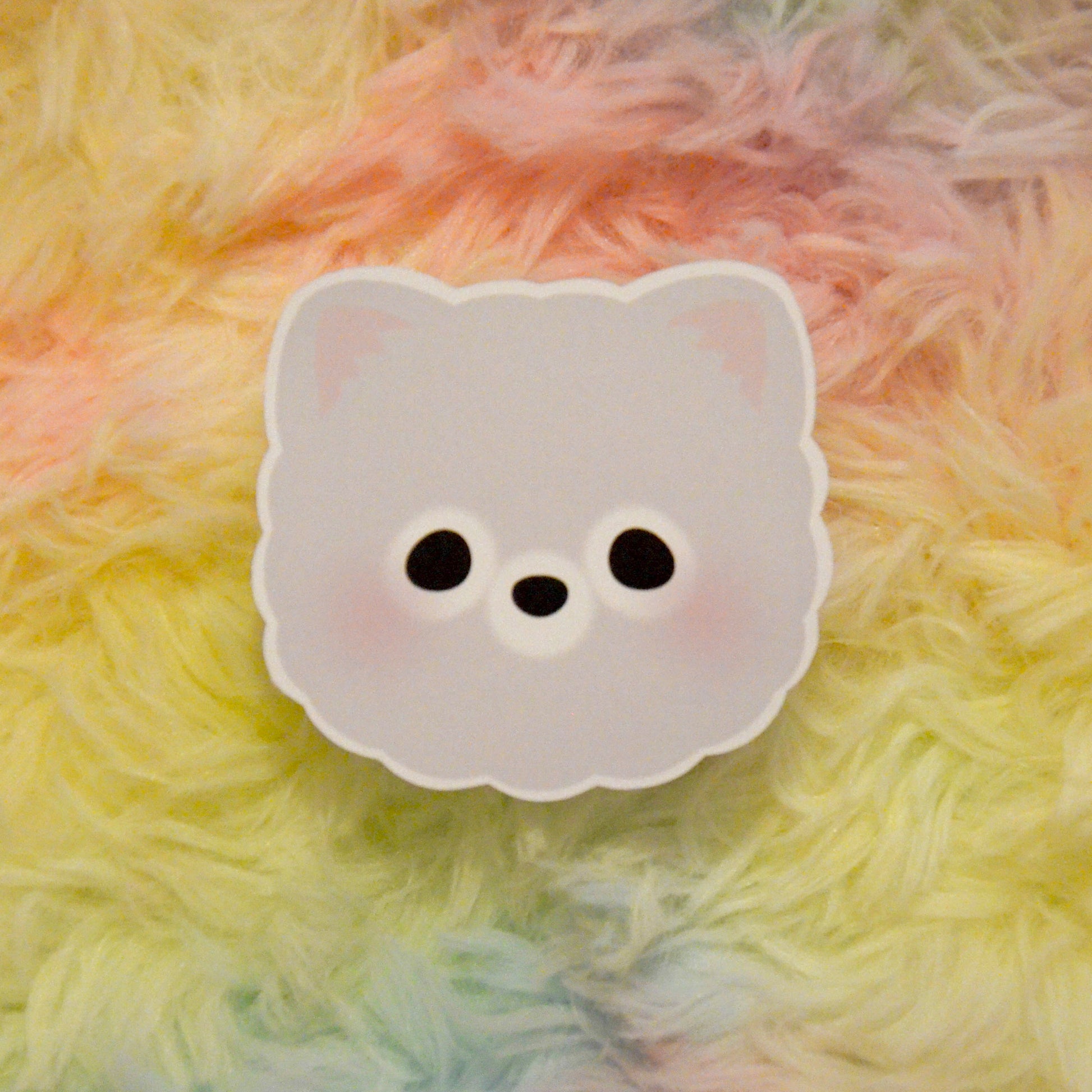 Pommy head sticker against rainbow background