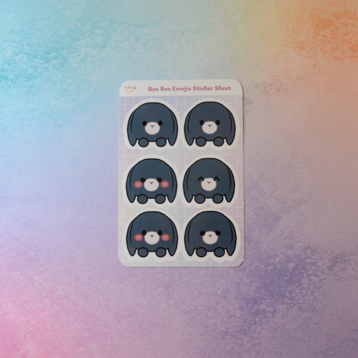 Bon Bon Emojis Sticker Sheet on pastel rainbow background