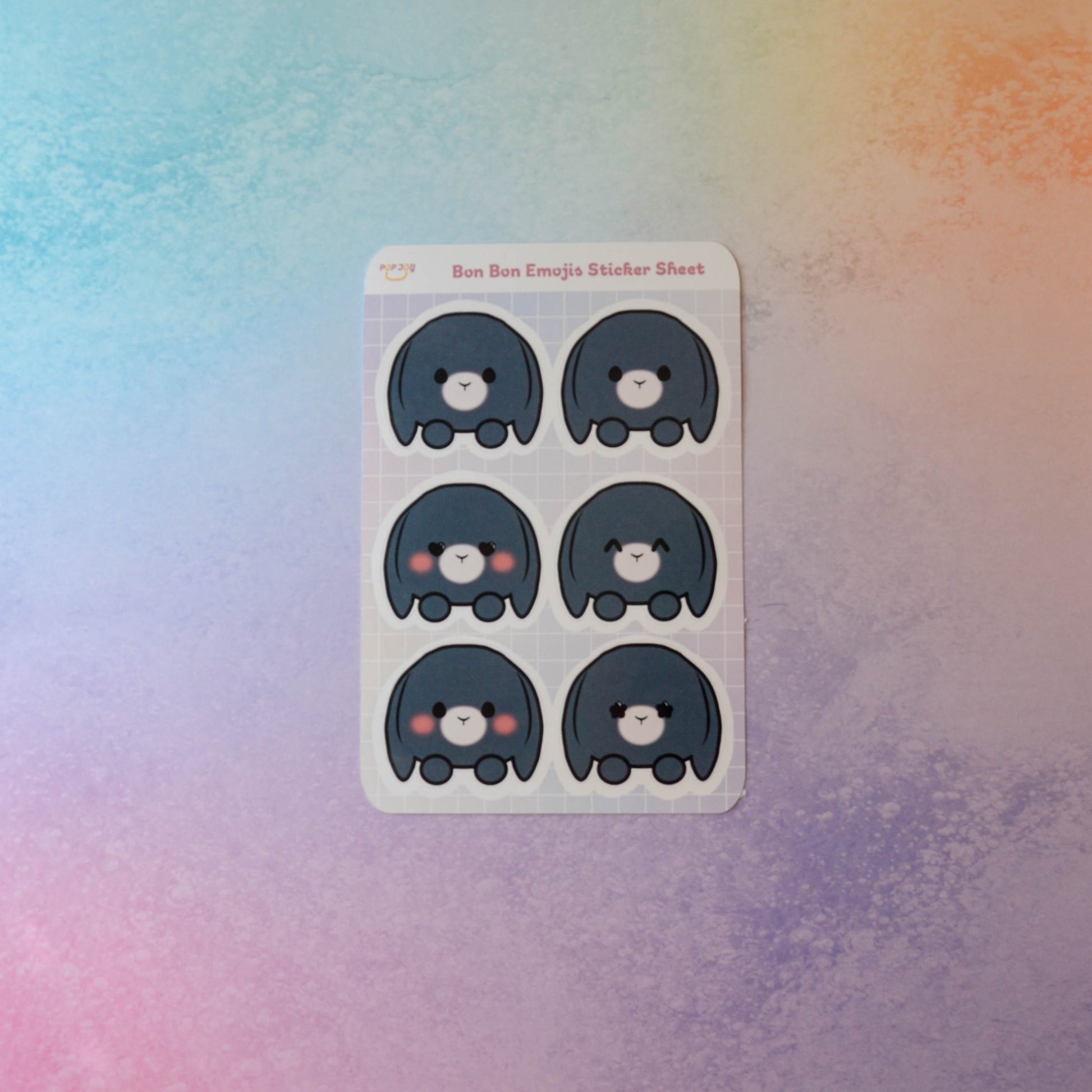 Bon Bon Emojis Sticker Sheet on pastel rainbow background