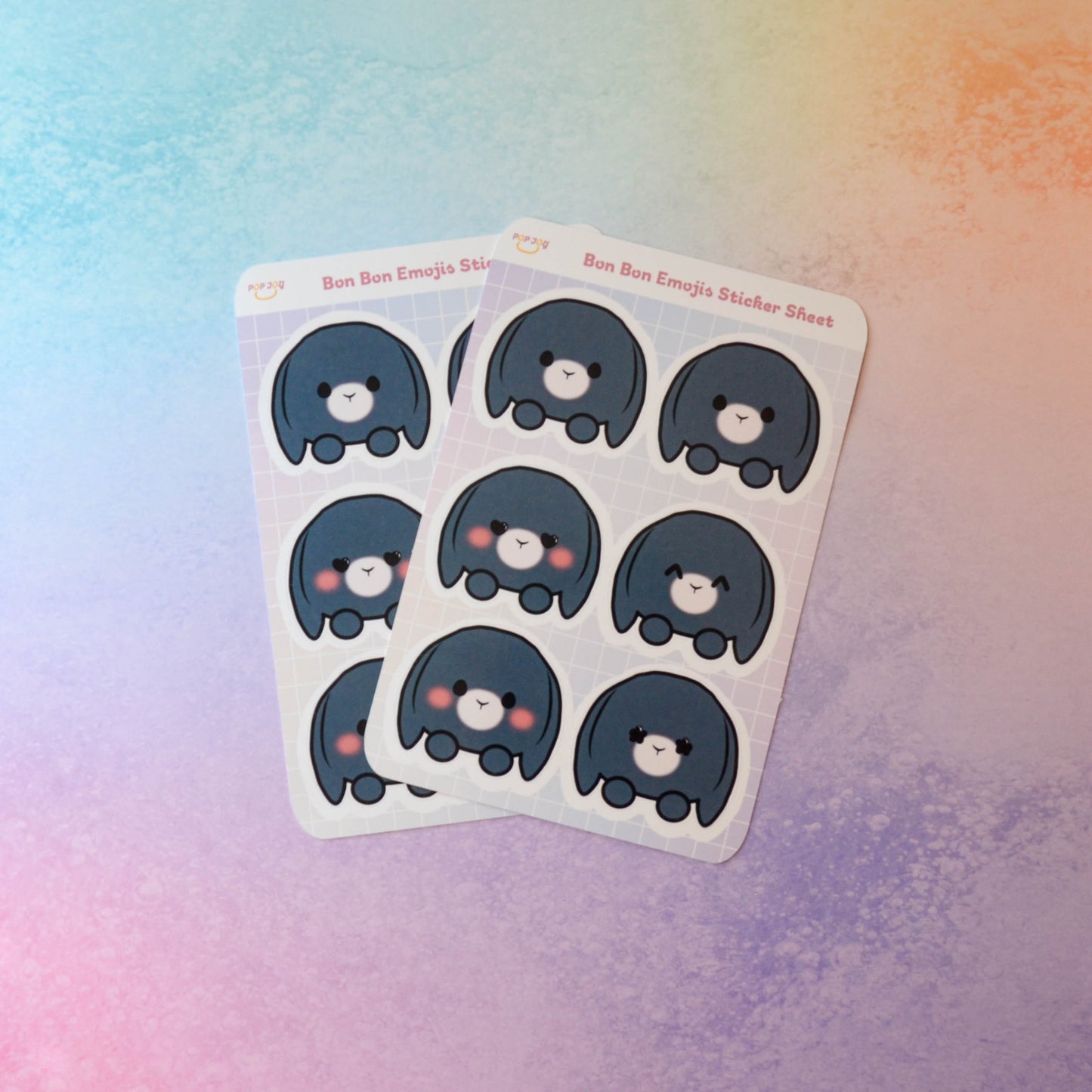 2 Bon Bon Emojis Sticker Sheets on pastel rainbow background