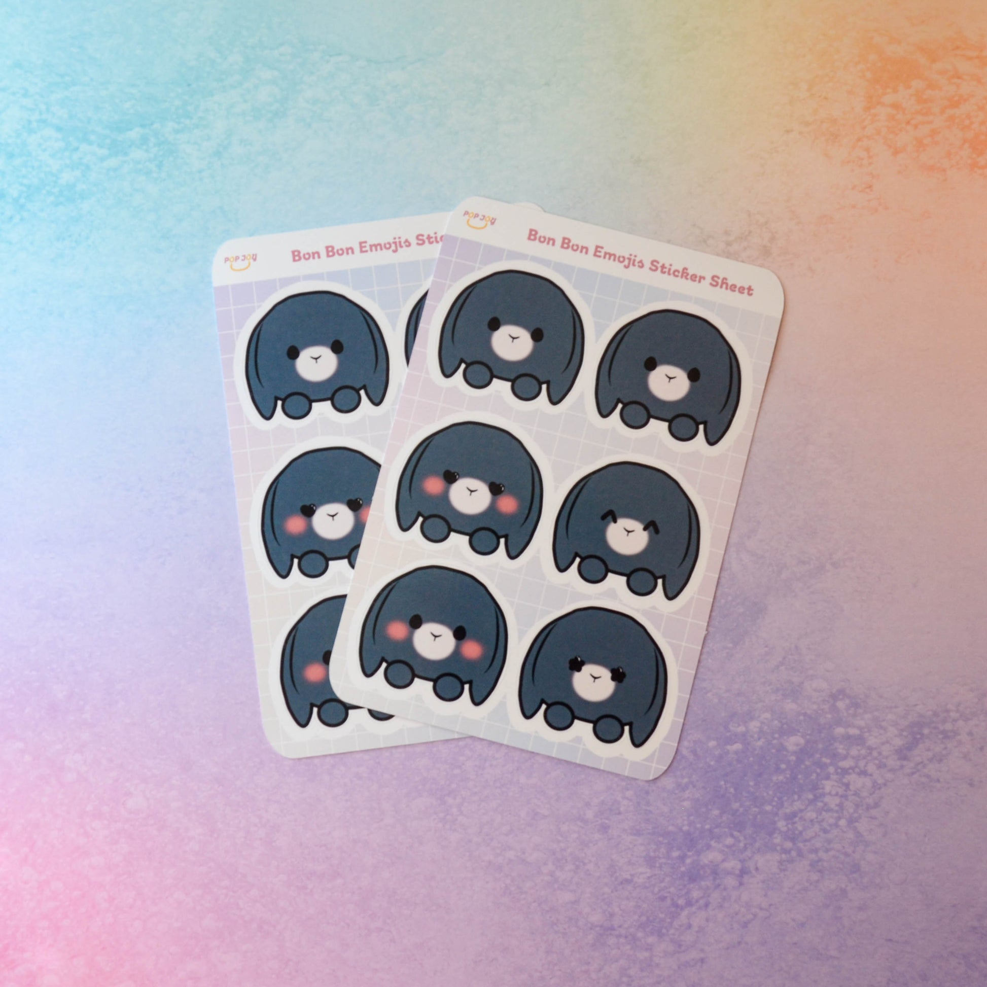 2 Bon Bon Emojis Sticker Sheets on pastel rainbow background