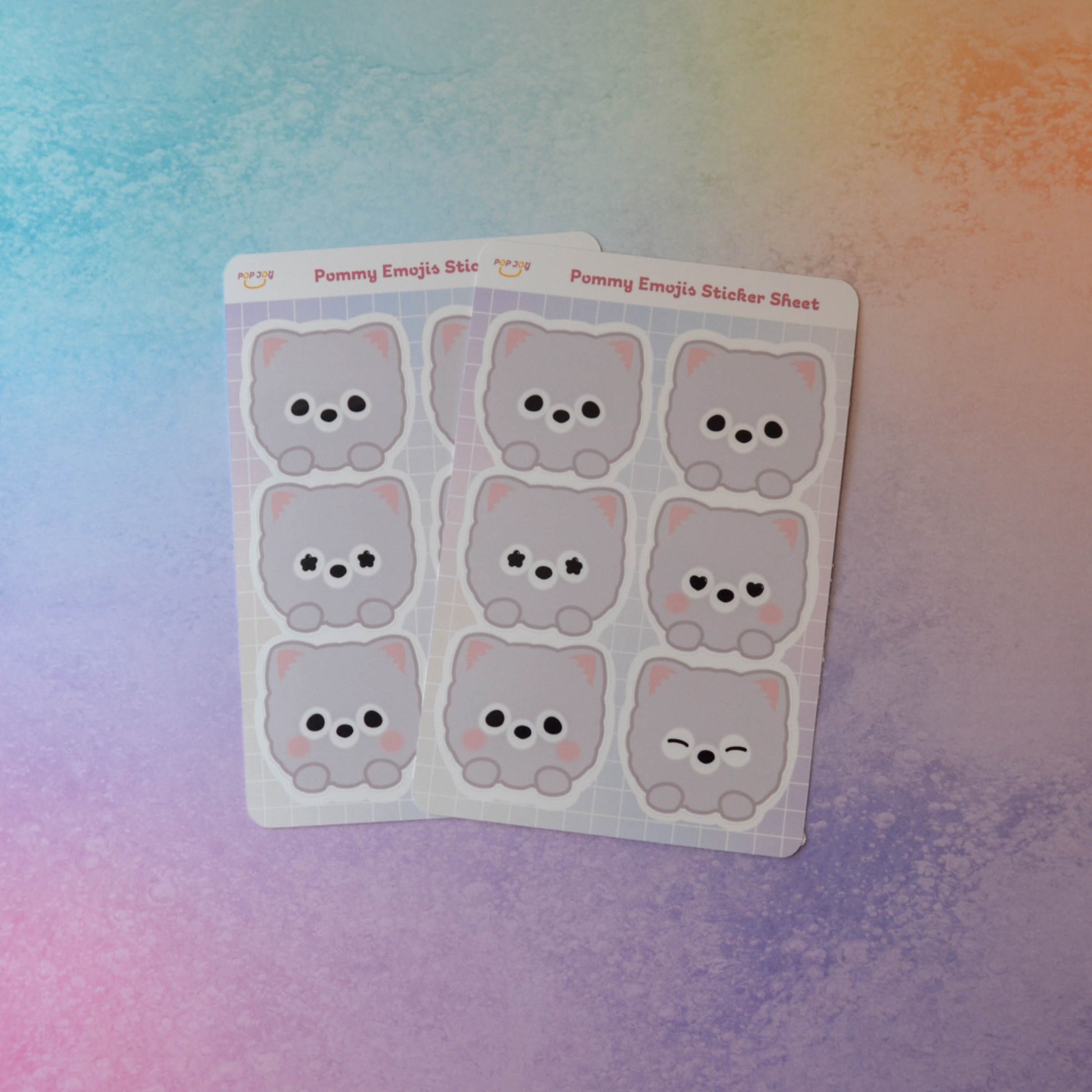 2 Pommy Emojis Sticker Sheets on pastel rainbow background